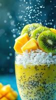 Refreshing tropical smoothie bowl topped with fresh fruit and coconut flakes on a vibrant background photo