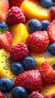 Bright and colorful fruit arrangement showcasing strawberries, blueberries, raspberries, mango, and chia seeds on a vibrant background photo