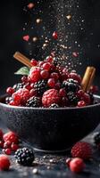 Berry medley with spices and falling powder creates a vibrant culinary display in a dark setting photo