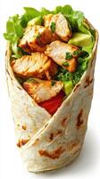 Freshly made chicken wrap filled with greens and vegetables on a white background photo