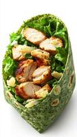Delicious spinach wrap filled with grilled chicken, fresh lettuce, and creamy dressing ready for a healthy meal photo