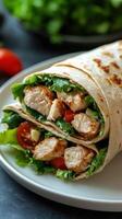 Delicious grilled chicken wrap with fresh lettuce and tomatoes ready to enjoy at lunch or dinner photo