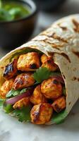 Grilled chicken wrapped in tortillas with cilantro and onions ready to be enjoyed photo