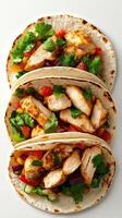 Deliciously prepared chicken tacos with fresh vegetables and herbs ready to enjoy at a vibrant gathering photo