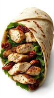 Grilled chicken wrap with fresh greens and sun-dried tomatoes served in a soft tortilla photo