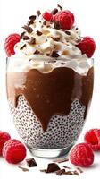 Delicious chocolate raspberry dessert with whipped cream and chocolate shavings served in a glass photo