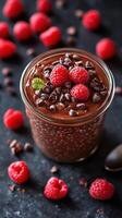 Creamy chocolate dessert topped with fresh raspberries and chocolate chips on a dark surface photo