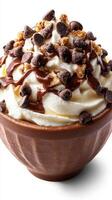 Decadent dessert in a brown bowl topped with whipped cream, chocolate chips, and crumbled cookies photo