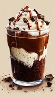 Decadent dessert featuring layers of chocolate, whipped cream, and cookie crumbles served in a clear glass cup at a cozy cafe photo