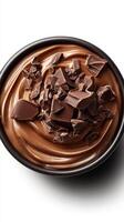 Decadent chocolate mousse topped with rich chocolate chunks in a black bowl photo