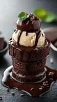 Delicious chocolate dessert with ice cream served on a dark table during a gourmet dining experience photo