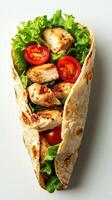 Grilled chicken wrap with fresh lettuce and tomatoes ready for a delicious meal photo