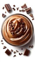 Rich chocolate mousse dessert garnished with chocolate chips arranged artistically on a white background photo