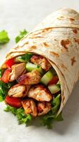 Fresh chicken wrap filled with vegetables in a soft tortilla showcasing healthy eating photo