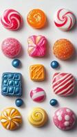 Colorful candies arranged in a vibrant pattern on a white surface illustrating a playful dessert experience photo