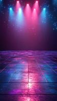 Colorful stage lights illuminate an empty dance floor in a dimly lit venue at night photo