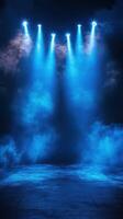 Dramatic blue lighting illuminates an empty stage with fog effects for a captivating performance atmosphere photo