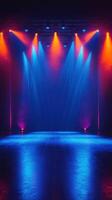Colorful stage lights illuminate an empty venue in preparation for an upcoming performance photo