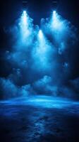 Stage lights illuminate a misty performance space with blue hues creating an atmospheric backdrop for entertainment events photo