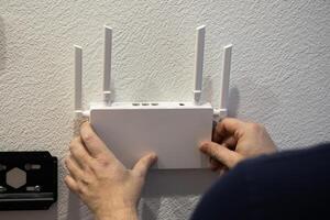 For optimal connectivity, installing a wireless router on the wall can enhance signal strength photo