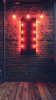 Bright red neon lights illuminate an industrial brick wall in a dimly lit space photo