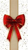 Decorated gift box with a red bow and golden accents against a festive background filled with stars and snowflakes photo