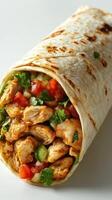Delicious chicken wrap filled with fresh vegetables and spices ready to enjoy for a quick meal at lunchtime photo