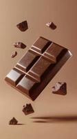 Floating chocolate bar surrounded by chocolate chunks against a simple brown background photo