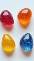 Colorful gelatin candies arranged artistically on a white surface with varying textures and shapes photo