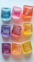 Colorful ice cubes arranged in a neat pattern, showcasing vibrant hues and textures, ideal for refreshing beverages and summer gatherings photo