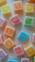 Colorful gummy candies arranged in an appealing manner on a white surface photo