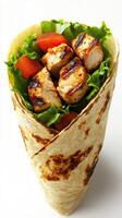 Grilled chicken wrap with fresh vegetables served in a tortilla on a plain background photo