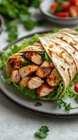 Grilled chicken wrap filled with fresh lettuce and herbs on a rustic plate ready to serve photo
