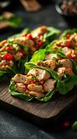 Delicious chicken lettuce wraps with fresh vegetables prepared in a cozy kitchen setting photo