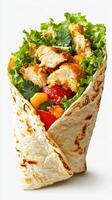 Fresh chicken wrap filled with vibrant vegetables and greens on a plain background photo