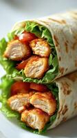 Delicious chicken wrap filled with fresh vegetables and flavorful sauce served in a restaurant photo