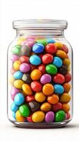 Colorful candy jar filled with various shaped sweets in vibrant hues placed on a white background photo