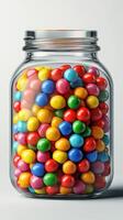 Colorful candy filled jar creates a vibrant display in a bright setting photo