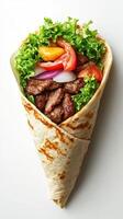 Delicious beef wrap filled with fresh vegetables and greens served in a toasted flatbread cone photo