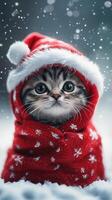 Cute kitten wearing a red Christmas sweater and Santa hat enjoys a snowy winter landscape while snowflakes fall gently photo