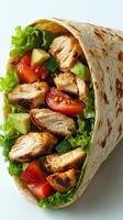 Fresh grilled chicken wrap filled with colorful vegetables and greens ready to enjoy photo