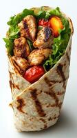 Delicious grilled chicken wrap filled with fresh vegetables and flavors at a casual dining spot photo