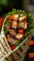 Delicious grilled chicken wrap filled with fresh vegetables and herbs ready to be enjoyed photo