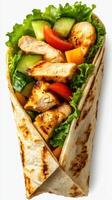 Grilled chicken wrap filled with fresh vegetables enjoyed as a healthy lunch option in a casual setting photo