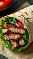 Deliciously grilled meat wrap filled with fresh vegetables on a wooden surface photo