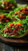 Flavorful lettuce wraps filled with seasoned ground meat and fresh vegetables prepared in a cozy kitchen setting photo