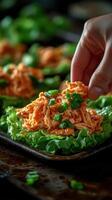 Fresh lettuce wraps filled with pulled chicken and green onions prepared in a cozy kitchen setting photo