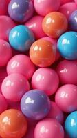 Colorful bouncy balls in an array of vibrant hues filling a playful space photo