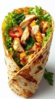 Grilled chicken wrap featuring fresh lettuce and tomatoes, enjoyed as a quick meal option photo