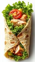 Fresh chicken wrap filled with crisp lettuce and tomatoes prepared for a healthy meal option photo